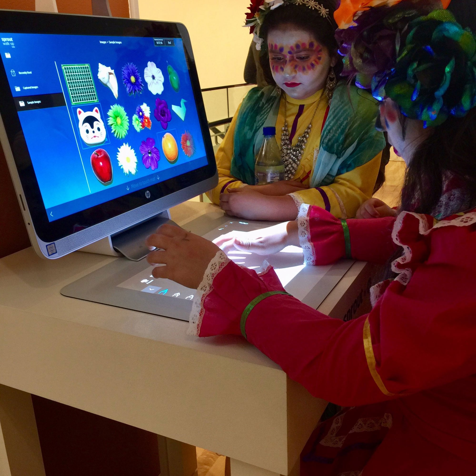 Children interacting with Sprout touch mat at event